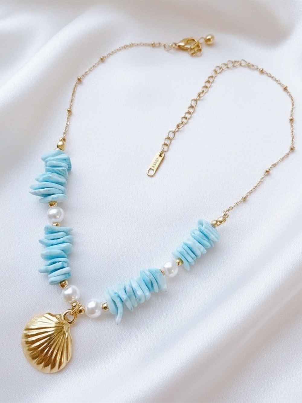 Gold Shell Pendant Necklace with Light Blue Stone and Pearl Accents